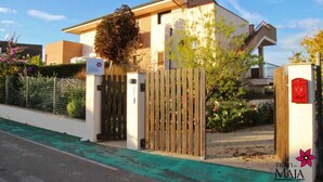 A modern building with a gated entrance, a signboard, and a mailbox. - 30 sqm studio apartment - Kitchenette with living area, sleeping area, bathroom  (Miglianico)
