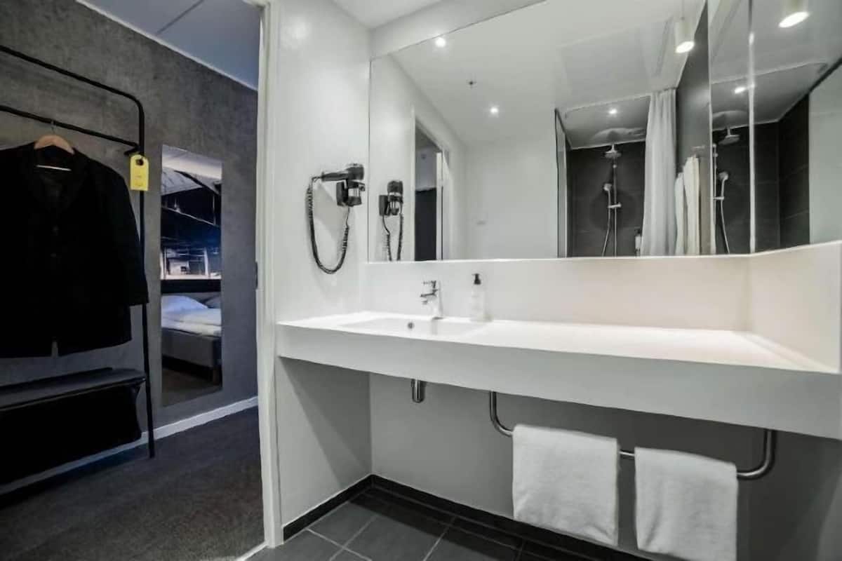 Bathroom | Shower, rainfall showerhead, hair dryer, towels