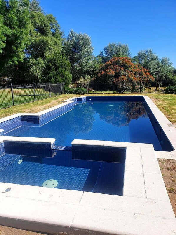 Seasonal outdoor pool, pool loungers