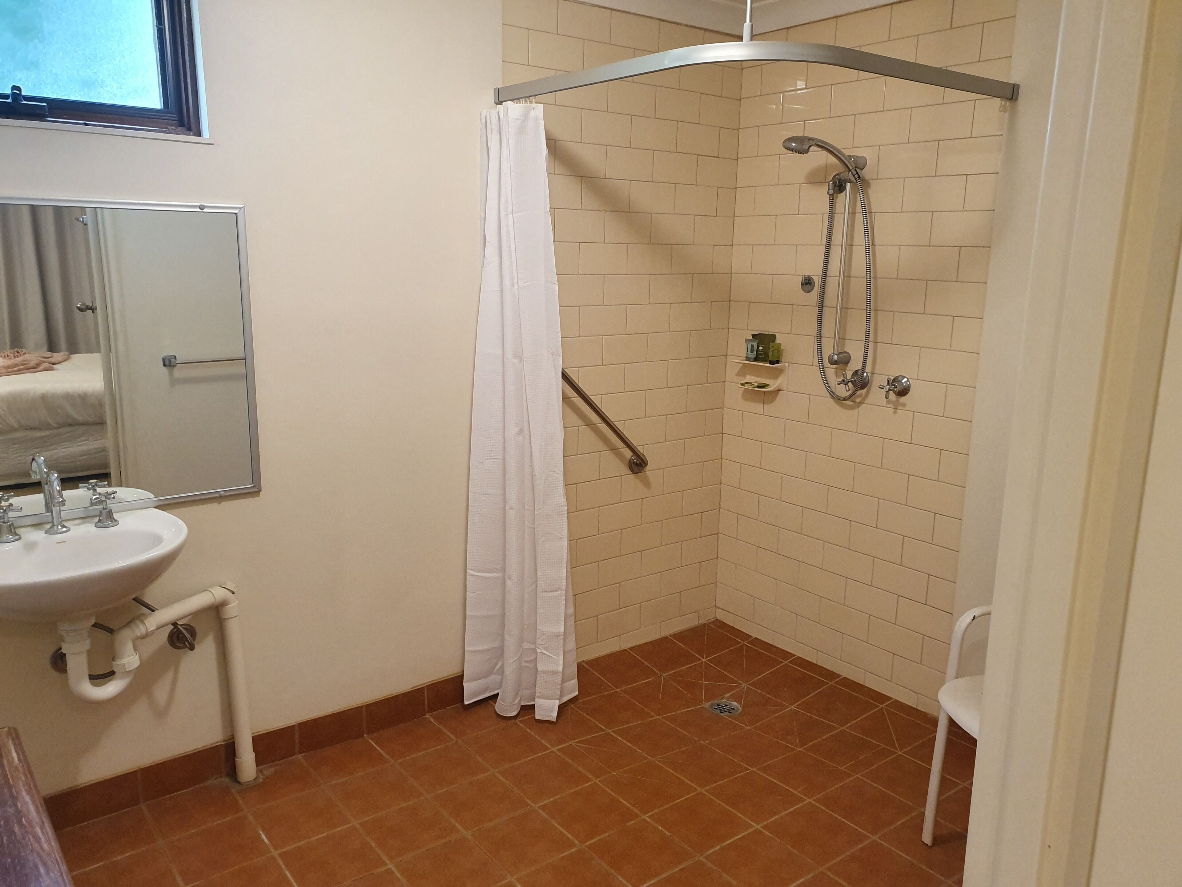 Accessible Room | Bathroom | Rainfall showerhead, designer toiletries, hair dryer, towels