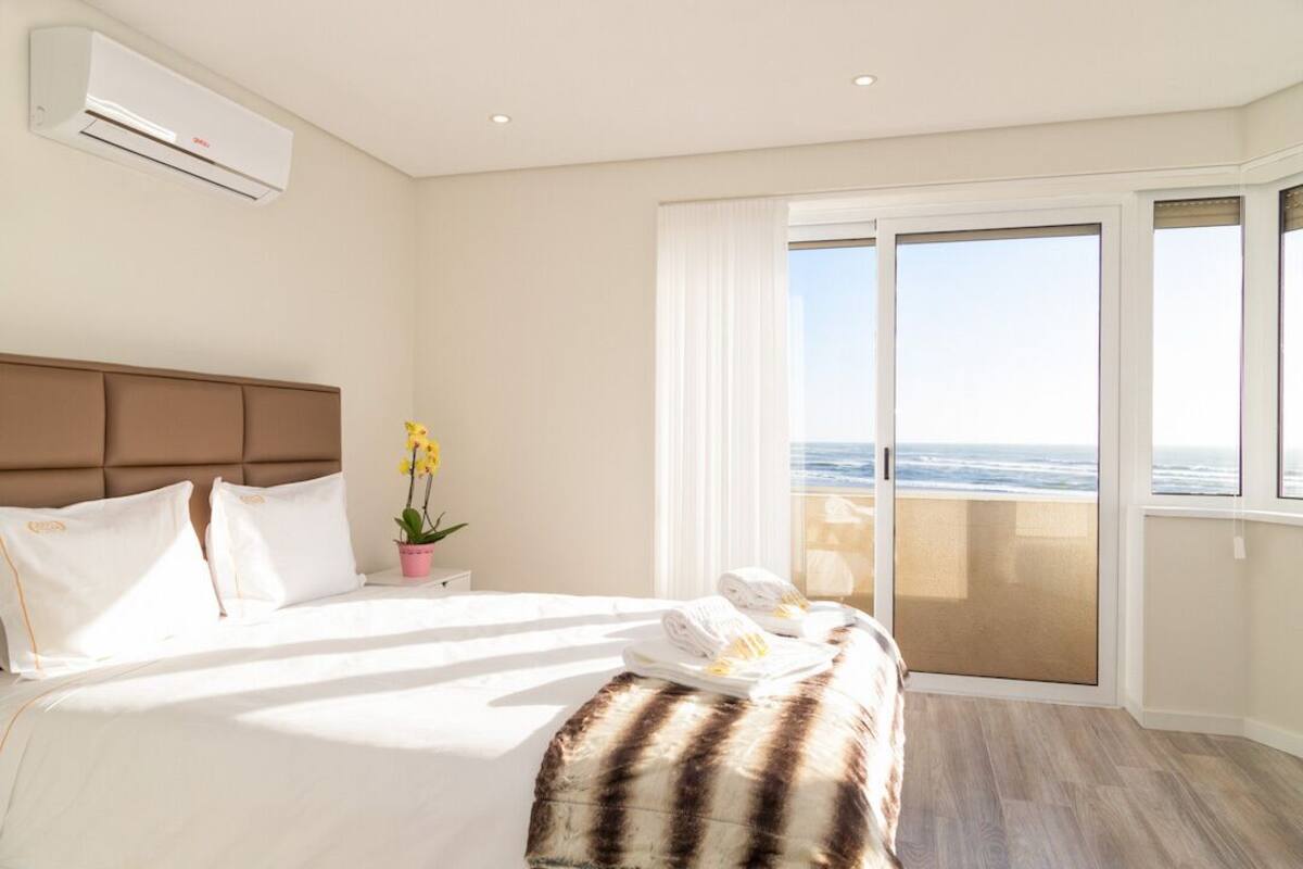 Apartment, 1 Bedroom, Sea View | 1 bedroom, blackout curtains, iron/ironing board, free cots/infant beds