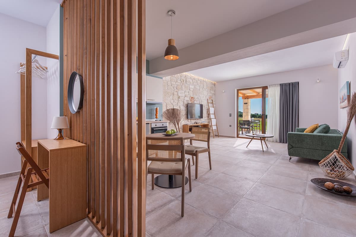 Junior Suite, Sea View | Living area | 50-inch flat-screen TV with cable channels, TV