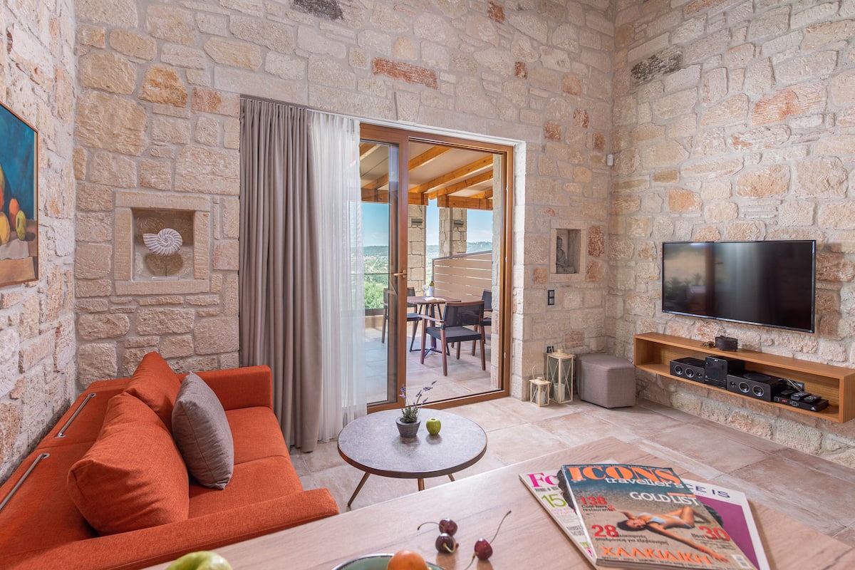 Premium Suite, Partial Sea View | Living room | 50-inch flat-screen TV with cable channels, TV