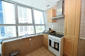 Apartment (Awad) | Private kitchen | Fridge, oven, stovetop, electric kettle - One Bedroom Apt. in JLT near Metro Station -AWD (Dubai)