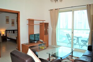 Apartment (Marina Views) | Living room | LCD TV - Fully Furnished 1BR with Balcony & Marina View - MRVW (Dubai)