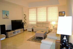 Apartment (Murad) | Living room | 42-inch TV with cable channels - Stylish 1BR near MOE - MRD (Dubai)