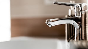 A modern bathroom with a chrome faucet and a white sink. - MIxx Hotel (Karakol)