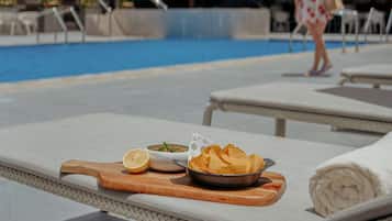 Outdoor pool, open 6:30 AM to 6:00 PM, pool umbrellas, pool loungers