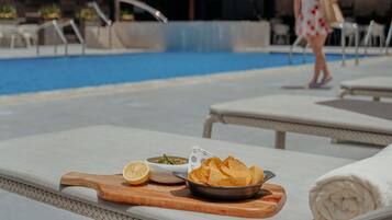 Outdoor pool, open 6:30 AM to 6:00 PM, pool umbrellas, pool loungers