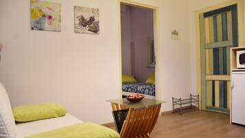 Standard Apartment, 1 Bedroom | Living area | 20-inch flat-screen TV with digital channels, TV