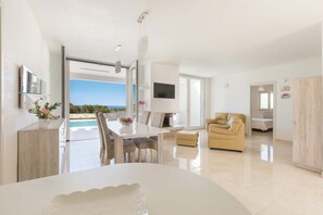 Comfort House, 3 Bedrooms | Living area | Flat-screen TV, fireplace - Villa Specchia (Carovigno)