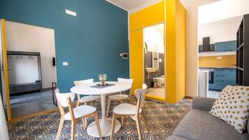 Deluxe Apartment | Living area | 20-inch flat-screen TV with digital channels, TV