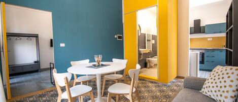 Deluxe Apartment | Living area | 20-inch flat-screen TV with digital channels, TV