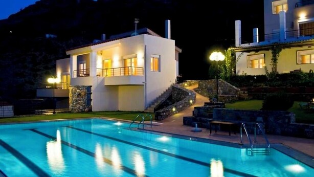 A modern two-story house with a swimming pool, stone steps, and outdoor lighting. - Agnanti Villas magnificent view, perfect for families and group up to 15 guests  (Heraklion Crete Agia Pelagia)