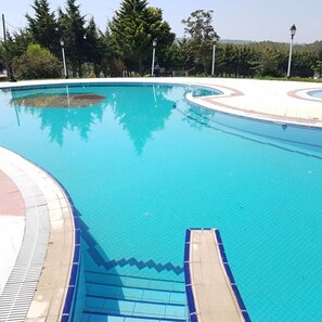 Seasonal outdoor pool, pool umbrellas, sun loungers