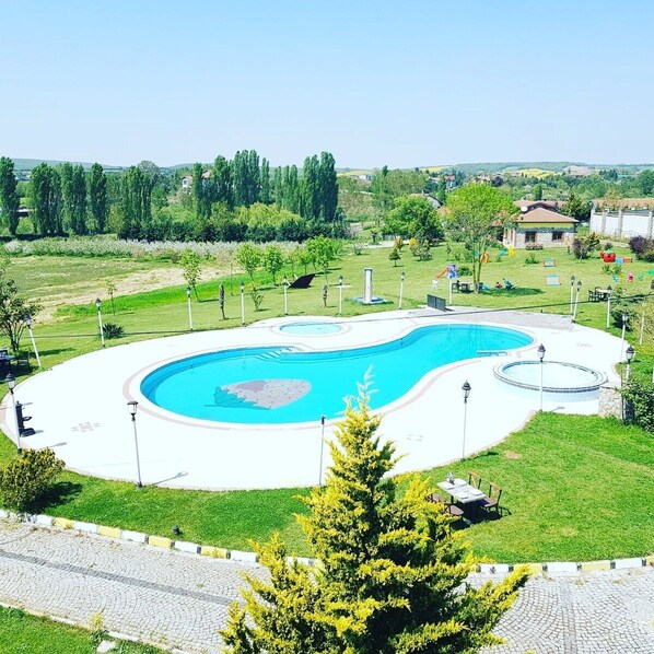 Seasonal outdoor pool, pool umbrellas, sun loungers