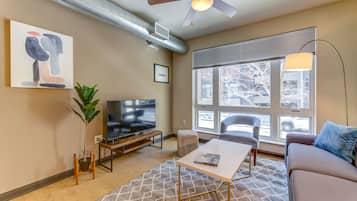 Comfort Apartment, 1 King Bed with Sofa bed, Non Smoking (Self Check-in with Virtual Front Desk) | Living room | 49-inch Smart TV with digital channels, TV, table tennis
