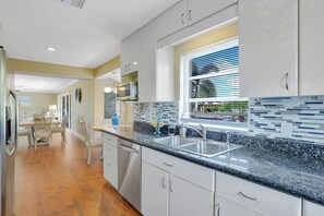 House, Multiple Beds (Pet-friendly two-story home with pool) | Private kitchen | Fridge, microwave, oven, stovetop - Pet-friendly Two-story Home With Pool, Spa, and Grill (Marco Island)
