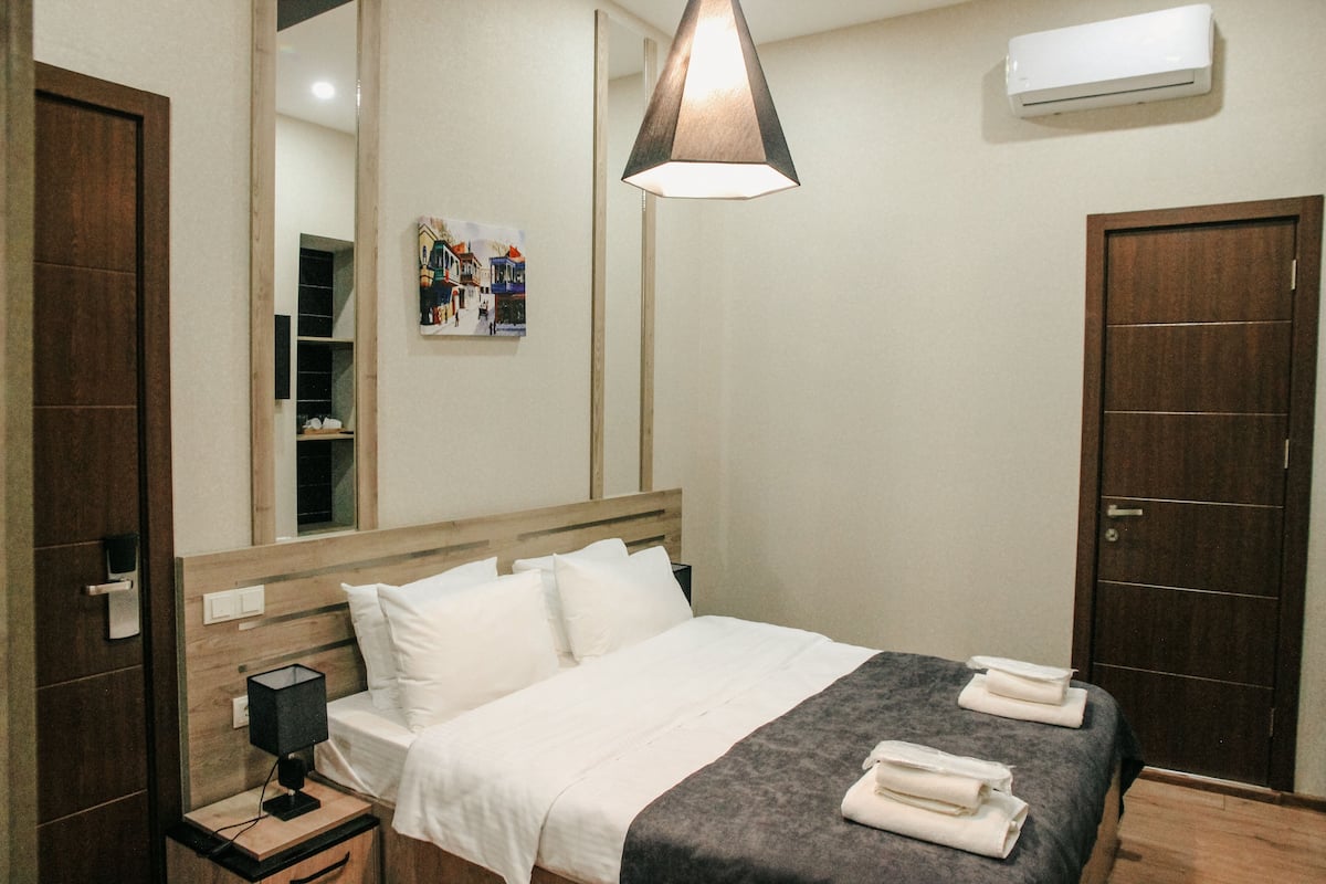 Family Room | Premium bedding, down comforters, memory foam beds, minibar