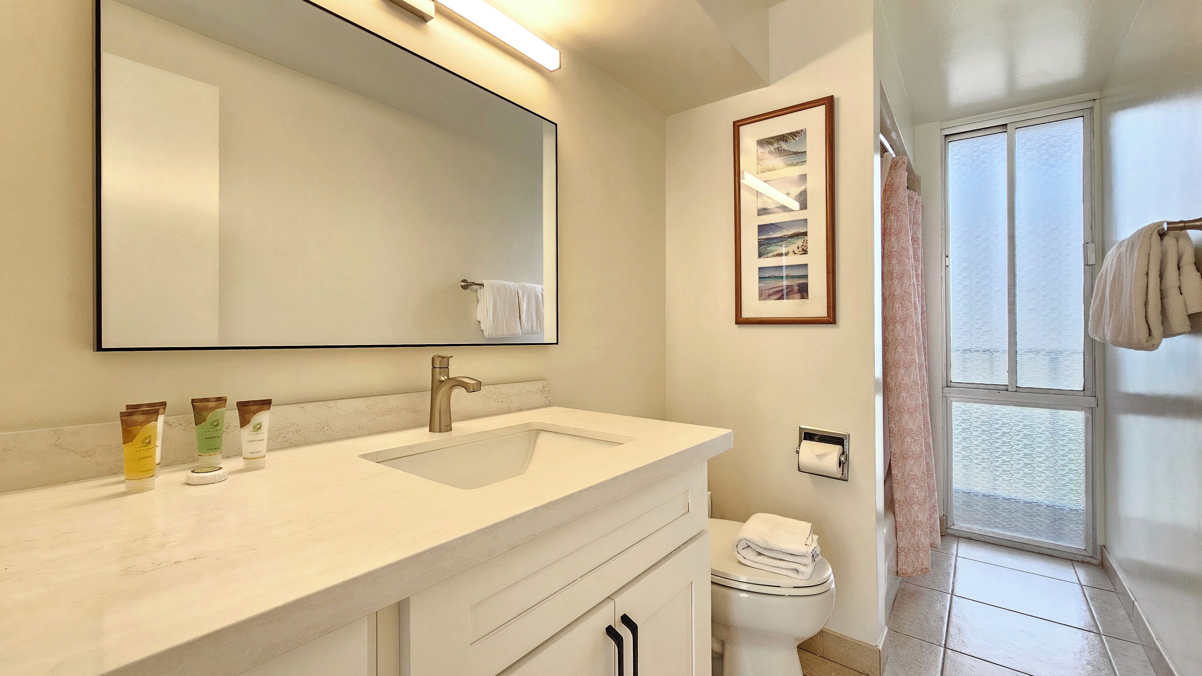 Combined shower/tub, hair dryer, towels, soap