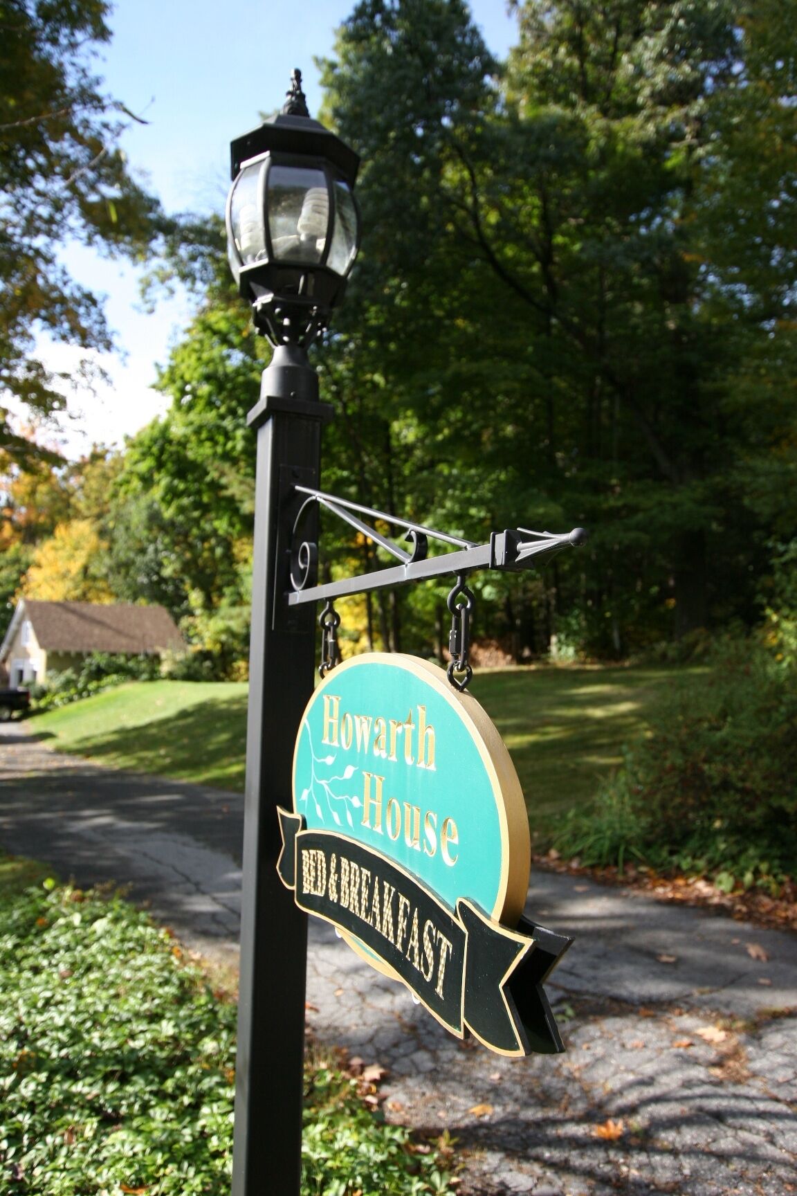 A sign for 'Howarth House Bed & Breakfast' with a directional arrow.