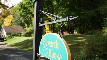 A sign for 'Howarth House Bed & Breakfast' with a directional arrow.