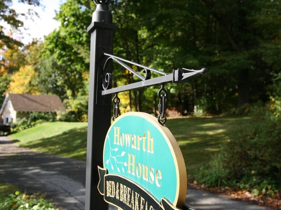 A sign for 'Howarth House Bed & Breakfast' with a directional arrow.