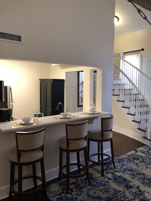 Enjoy cooking in this well-equipped kitchen with a central island and barstools.