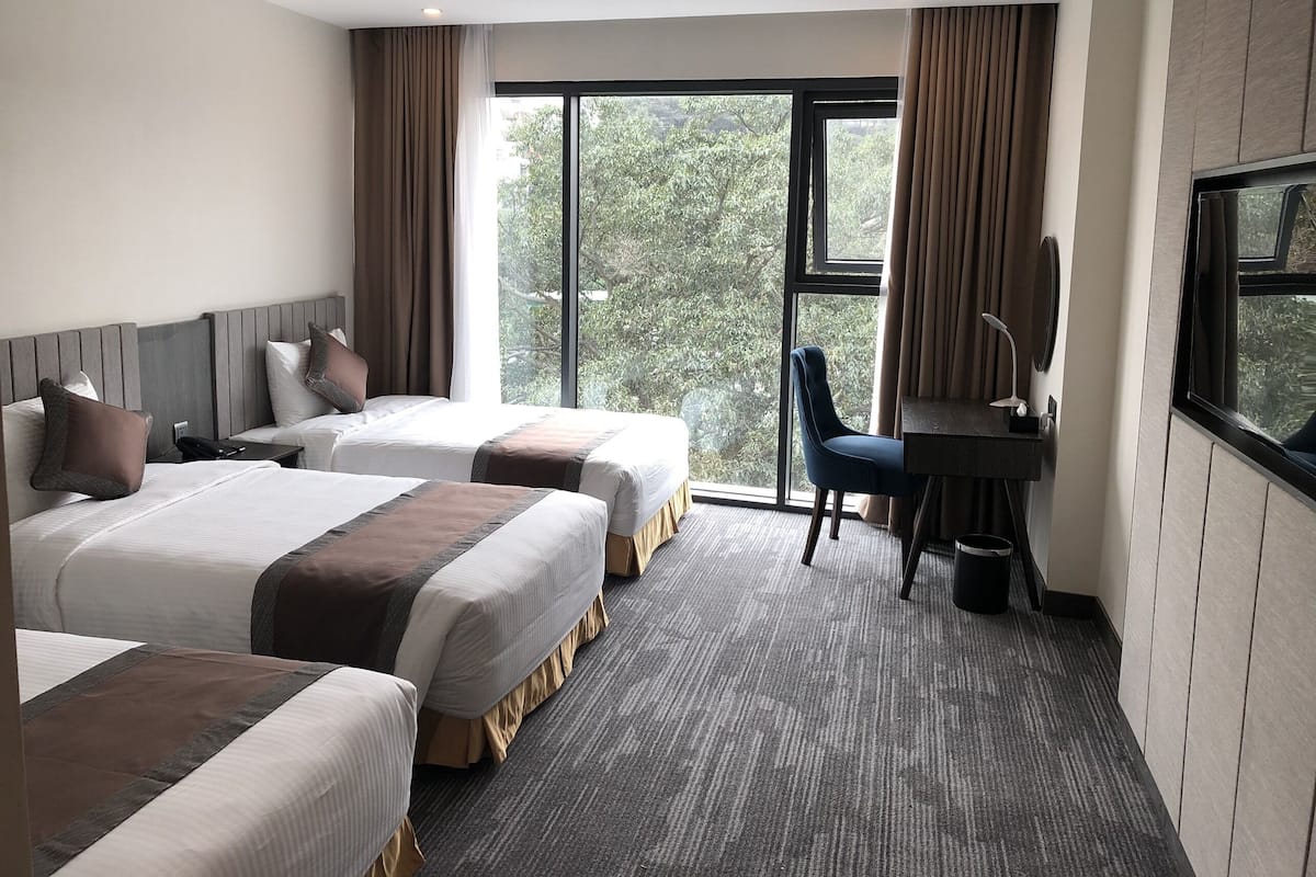 Deluxe Triple Room | 1 bedroom, minibar, in-room safe, individually decorated