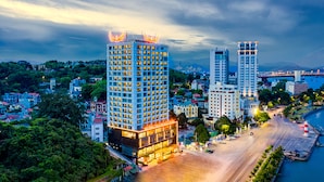 A high-rise hotel with multiple floors, a prominent entrance, and a view of the surrounding cityscape. - Muong Thanh Grand Bai Chay Hotel (Bai Chay)