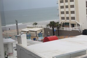 A coastal hotel with a view of the beach and ocean. - Ocean View Condo Daytona Inn (Daytona Beach)