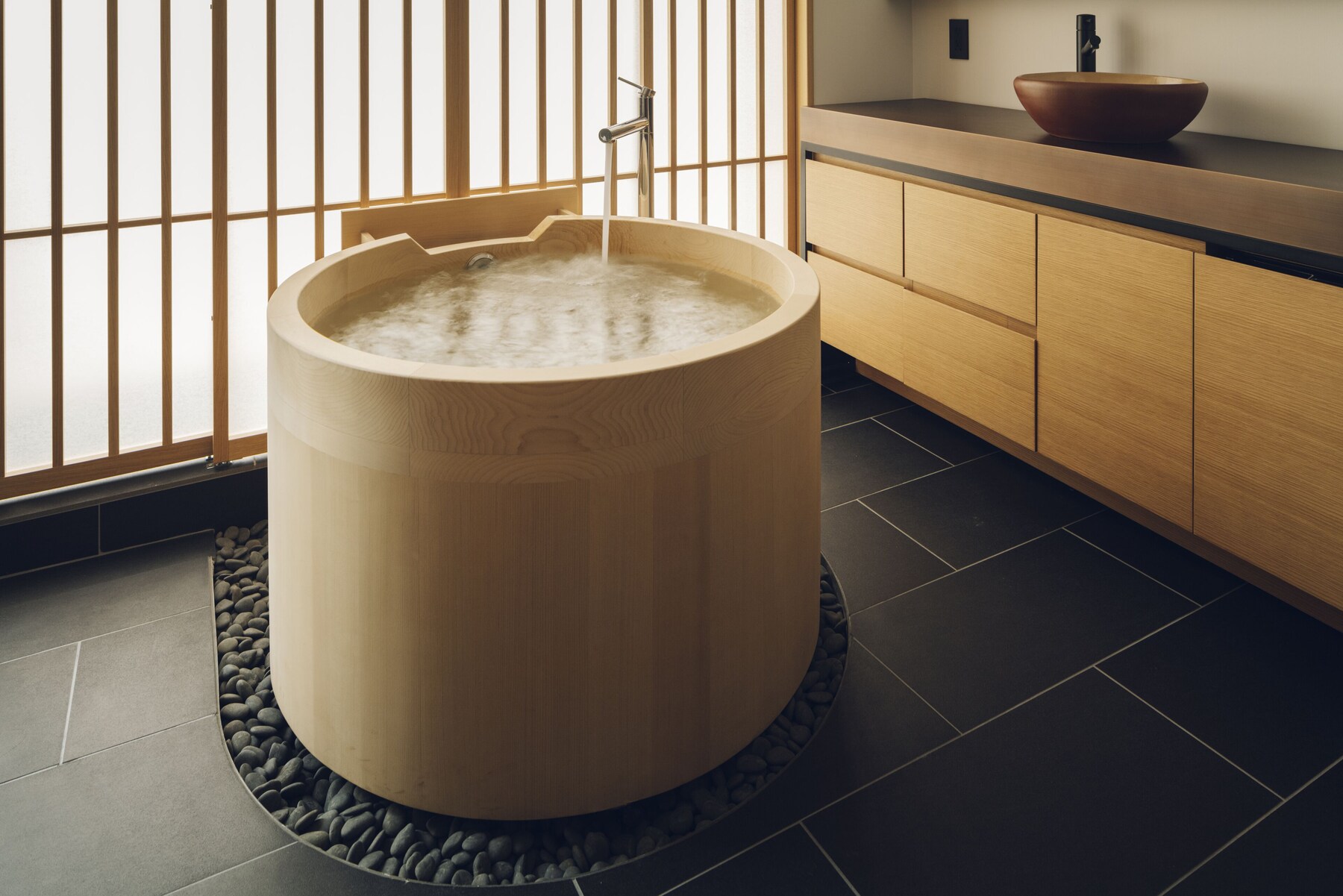 Separate tub and shower, free toiletries, hair dryer, slippers