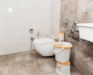 Habitación Deluxe | Baño | Ducha y cabezal de ducha tipo lluvia