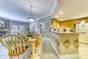 Enjoy cooking and dining in this well-appointed kitchen with a central island and range of appliances.