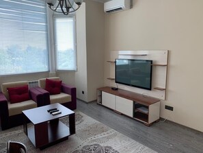 Apartment, 1 Schlafzimmer | Wohnbereich | Flachbildfernseher