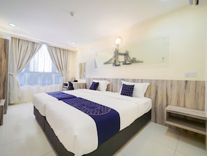 Habitación Deluxe con 2 camas individuales | Camas supletorias, wifi gratis, ropa de cama