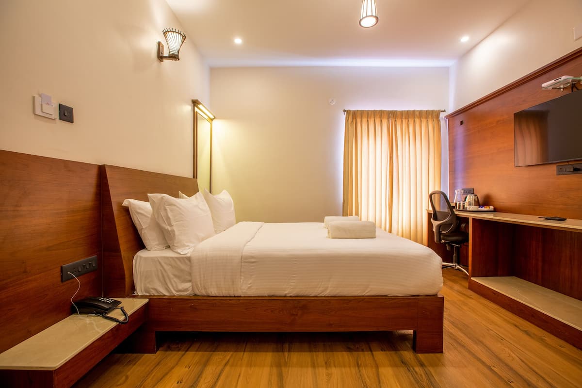 Habitación Deluxe | Decoración personalizada, wifi gratis y ropa de cama