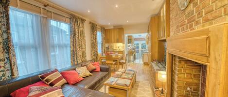 Smart TV, fireplace, books, printers