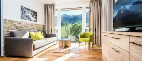 Superior Apartment, Mountain View (Cleaning Fee incl.) | Living area | 60-cm flat-screen TV with cable channels, TV, heated floors