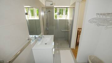 Villa | Bathroom | Shower, rainfall showerhead, hair dryer, towels