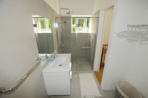 Villa | Bathroom | Shower, rainfall showerhead, hair dryer, towels