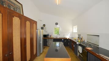Villa | Private kitchen | Full-size fridge, microwave, oven, stovetop