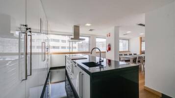 Full-size fridge, microwave, oven, cookware/dishes/utensils