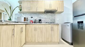 Fridge, microwave, stovetop, coffee/tea maker