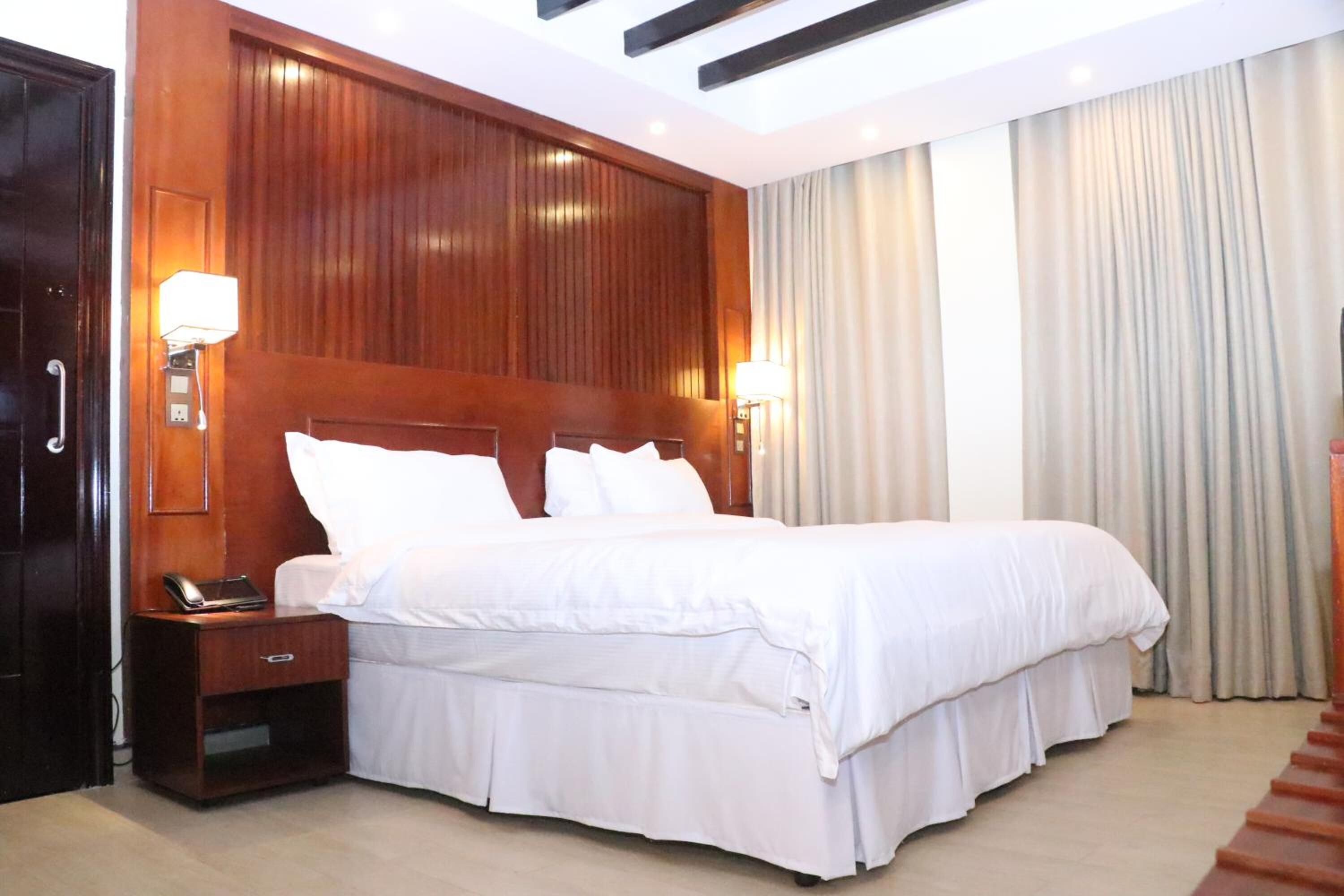 minibar, desk, laptop workspace, blackout curtains