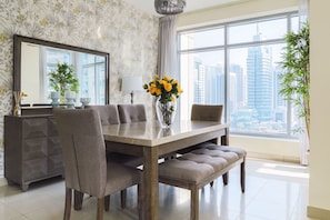 Enjoy meals with family and friends at this spacious dining area, featuring a large table and comfortable seating for six.