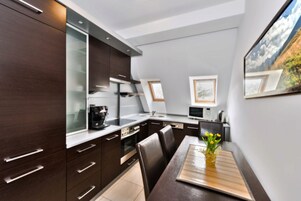 Apartment (A4) | Private kitchen | Fridge, stovetop, electric kettle, cookware/dishes/utensils