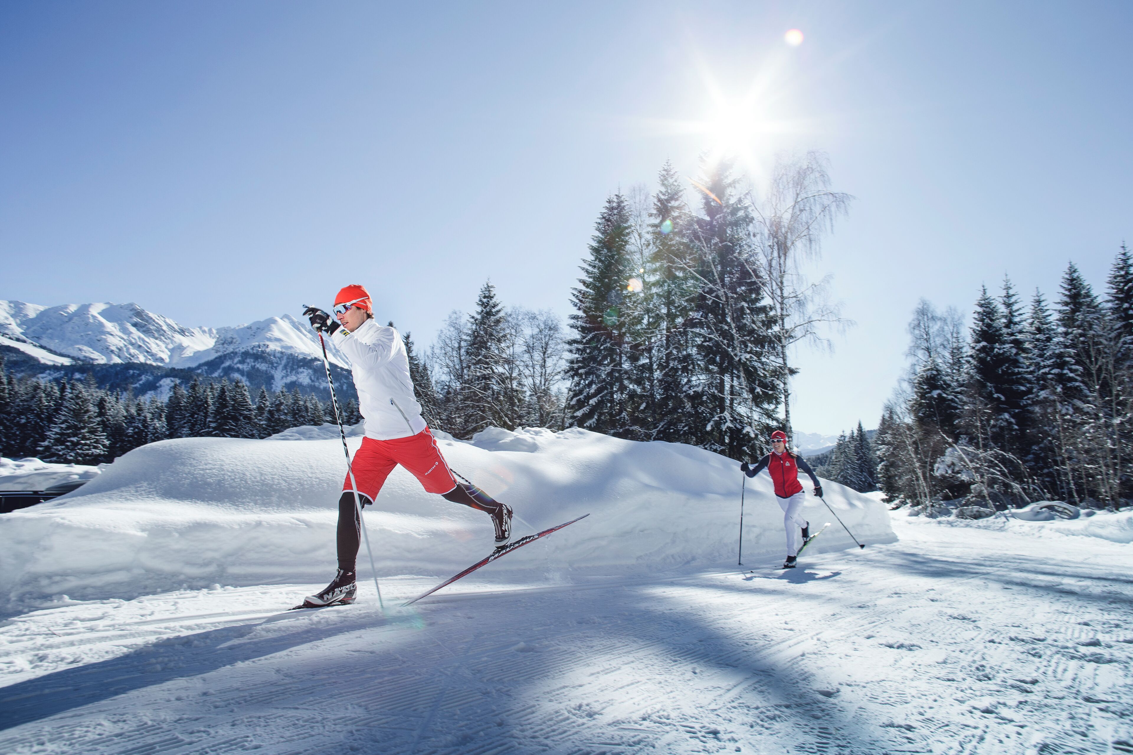 A snowy landscape with a skier in motion.