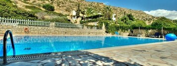Seasonal outdoor pool, open 8:00 AM to 8:00 PM, sun loungers