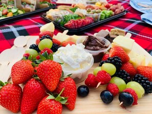 A variety of fruits and cheeses on a wooden board. - The George & Dragon Country Pub & Hotel (Tadley)